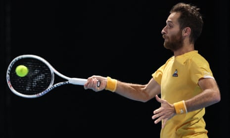 Constant Lestienne hits a return against Cameron Norrie.