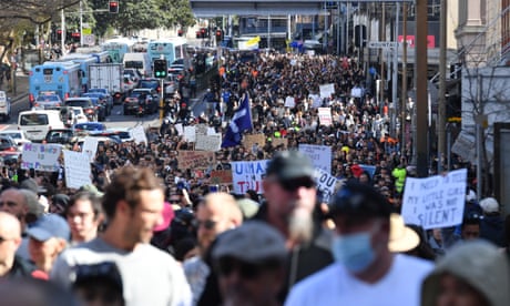 Protesters marched through central Sydney on Saturday, in breach of coronavirus stay-at-home orders.