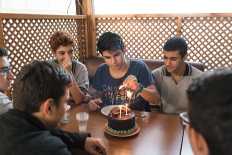 Halil (in blue T-shirt) took his friends to a Turkish cake shop to celebrate