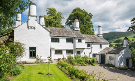 Exterior view of Townend, Cumbria. It is a whitewashed 17th-century farmhouse