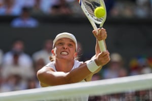 Iga Swiatek reached to return the ball to Amanda Anisimova at Wimbledon