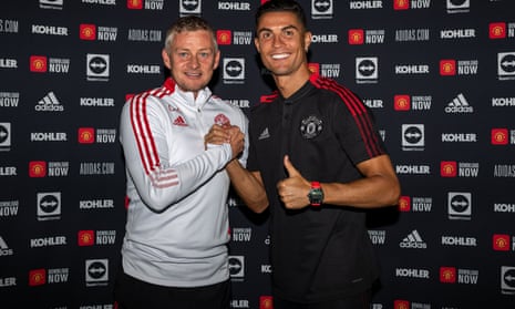 Cristiano Ronaldo with Ole Gunnar Solskjær after signing his contract this week