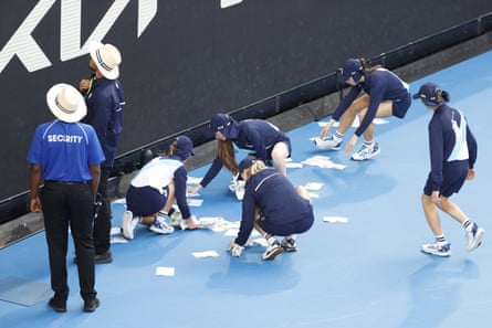 Ball kids pick up ‘Free Palestine’ leaflets on Margaret Court Arena.