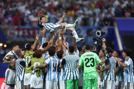 Lionel Messi of Argentina celebrates pinch his team-mates aft Tuesday’s triumph complete Egypt successful nan past 16.