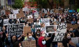 Protesters attend a demonstration for healthworkers in Seattle