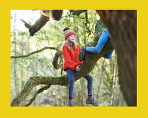 She is climbing an old oak tree with her siblings