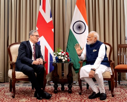 Britain’s prime minister Keir Starmer speaks with his Indian counterpart Narendra Modi during a bilateral meeting in Mumbai on October 9 2025.