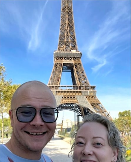 Two people in front of Eiffel Tower