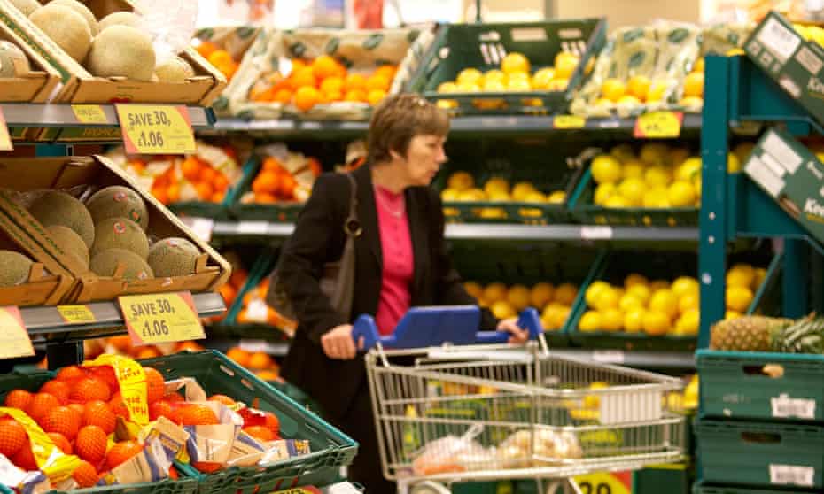 Supermarket shopper in fruit aisle