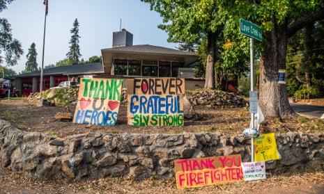 Signs displayed outside the Ben Lomond Volunteer Fire Department in Santa Cruz County, California.