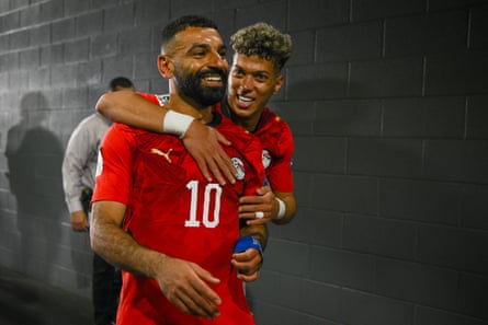 Mohamed Salah celebrates pinch Emam Ashour aft Egypt’s triumph connected penalties against Australia.