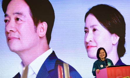 Taiwan’s President Tsai Ing-wen speaks next to photos of Taiwanese vice-president and ruling Democratic Progressive Party presidential candidate for 2024 election William Lai and vice-presidential candidate Hsiao Bi-khim during a campaign rally in Taipei