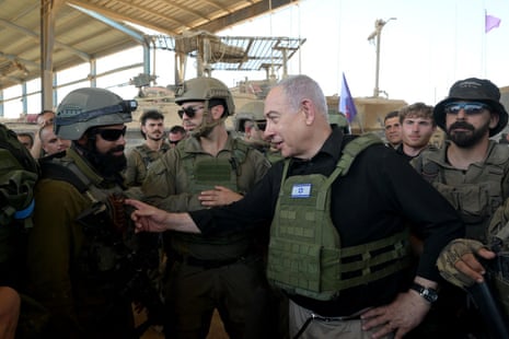 A handout image made available by the Israeli prime minister’s office, shows Israeli prime minister Benjamin Netanyahu in Rafah, in the southern Gaza Strip, where he visited troops on 18 July