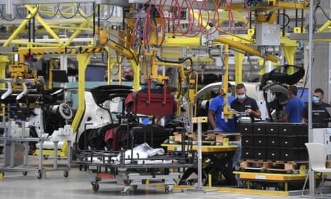 Employees work on the assembly line at the Smart car factory in Hambach, eastern France, on July 30, 2020.