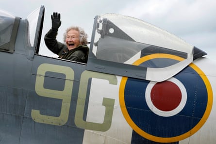 Dorothea Barron waves as she sits in a Spitfire at Biggin Hill airport in Kent.