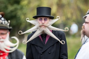 A contestant of the World Beard And Mustache Championships poses for a picture during the opening ceremony of the Championships