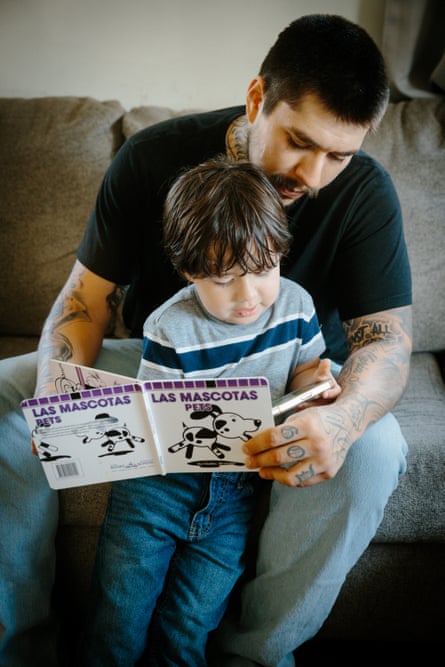 A man and a child reading a book