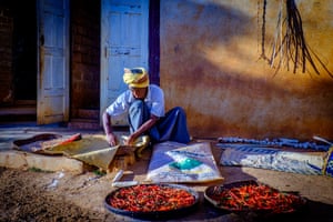 By Beverley Jenkins. An elderly man sorts through his harvest in a Myanmar minority tribe village. I love the colour and texture of the wall, contrasted with the chillis.