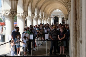 Tourists queue to enter the Doge’s Palace