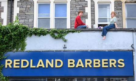 Two residents share a rooftop breakfast.