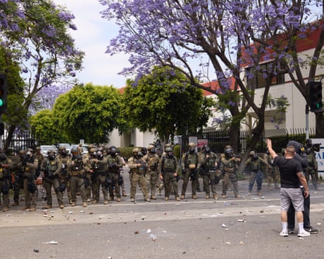 National guard troops sent by Trump arrive in LA following protests against immigration raids – US politics live