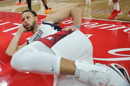 Stephen Curry of the United States strikes a pose after falling out of bounds after he was fouled by Shai Gilgeous-Alexander of Canada in the second half of their exhibition game on Wednesday night.