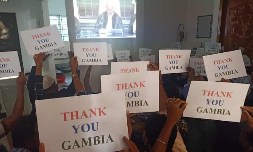 A Rohingya community in Kutupalong watches the sentence delivery and holds thank you notes for the Gambia, which brought the case against Myanmar to the ICJ.
