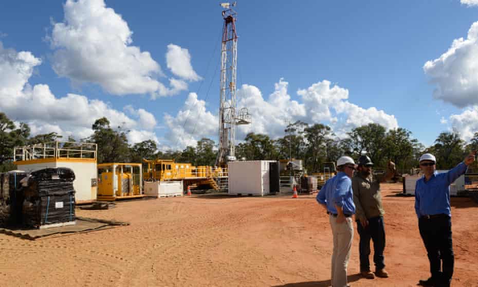 Santos staff at a coal seam gas well rig in the Pilliga forest