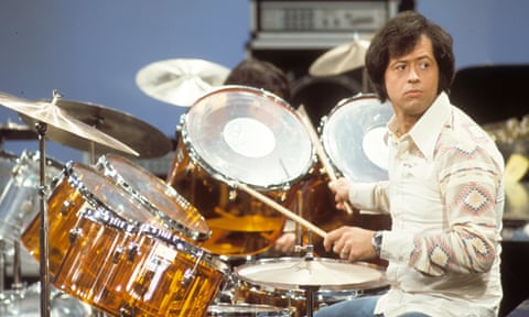 Wayne Osmond performing in the 1970s. He possessed a fine baritone voice and played various instruments including the drums, saxophone and lead guitar.