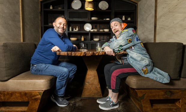 Comedians Geoff Norcott and Rufus Hound chatting at a table at Hide restaurant in London