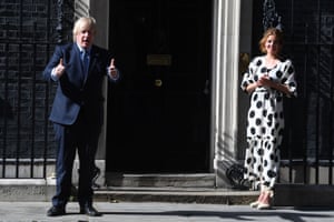 As part of the NHS birthday celebrations, Prime Minister, Boris Johnson and Annemarie Plas, founder of Clap For Our Carers, outside 10 Downing Street, London, join in the pause for applause to salute the NHS 72nd birthday.