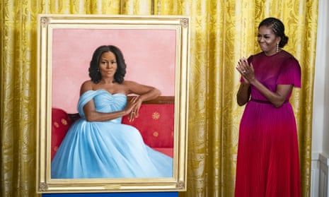 Michelle Obama next to her White House portrait