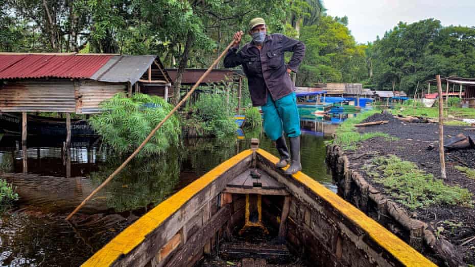 Charcoal producer Alberto Hernandez waits on his boat in San Agustin in Ciénaga de Zapata national park