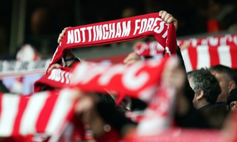 Nottingham Forest fans holding aloft scarves