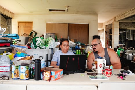 a woman and man on the computer