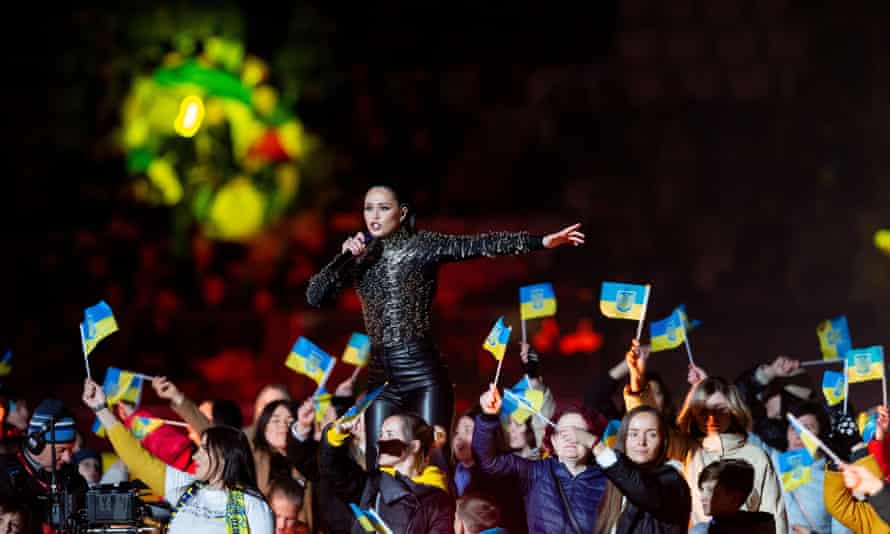 The Ukrainians join in a pre-match concert in the center circle.