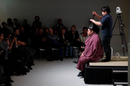 Hakuoho Tetsuya has his hair put in the traditional topknot as part of a demonstration held at Japan House