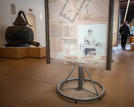 A museum panel about historic slavery at Groot Constantia winery stands on a metal stand