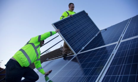 Solar panels being installed as part of a renewable green energy policy