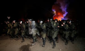 Police in Novi Sanzhary. Demonstrators, some of whom appeared drunk, put up road blocks, burned tyres and clashed with hundreds of riot police.