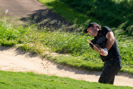 Patrick Reed hits out of the sand on the 11th hole during the final round in the Tournament of Champions