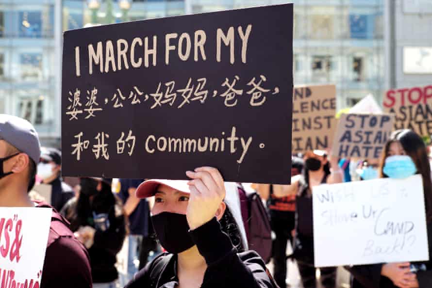 People take part in a rally against racism and violence on Asian Americans at the Union Square in San Francisco on 27 March.