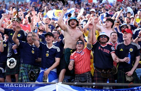 Scotland fans cheer in the stands before the match.