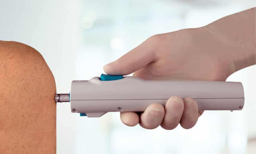 A medical device with a short nozzle instead of a sharp needle pressed against someone's arm
