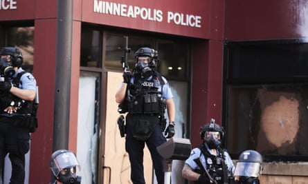 Police in riot gear outside the third precinct during protests over the death of George Floyd in Minneapolis.