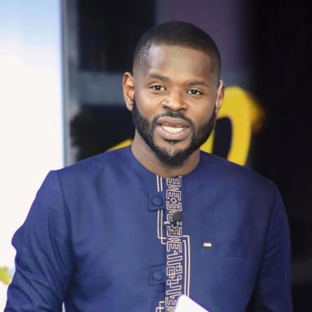 Portrait of a young black man with short hair and a beard.