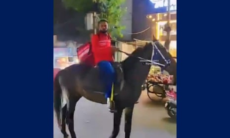 Zomato rider resorts to horsepower in Hyderabad after truckers’ strike causes fuel shortage and traffic jams.