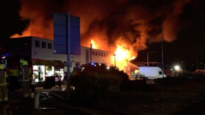 London, England: emergency responders work at the scene of a fire at Hainault Business Park