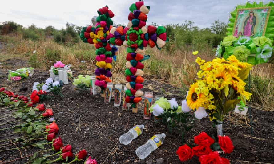 Flowers and candles are placed the area where the truck was found.
