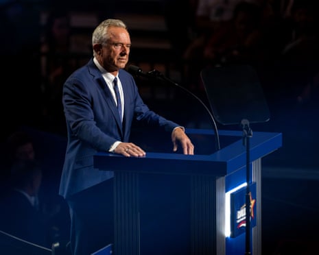 A man stands at a lectern.